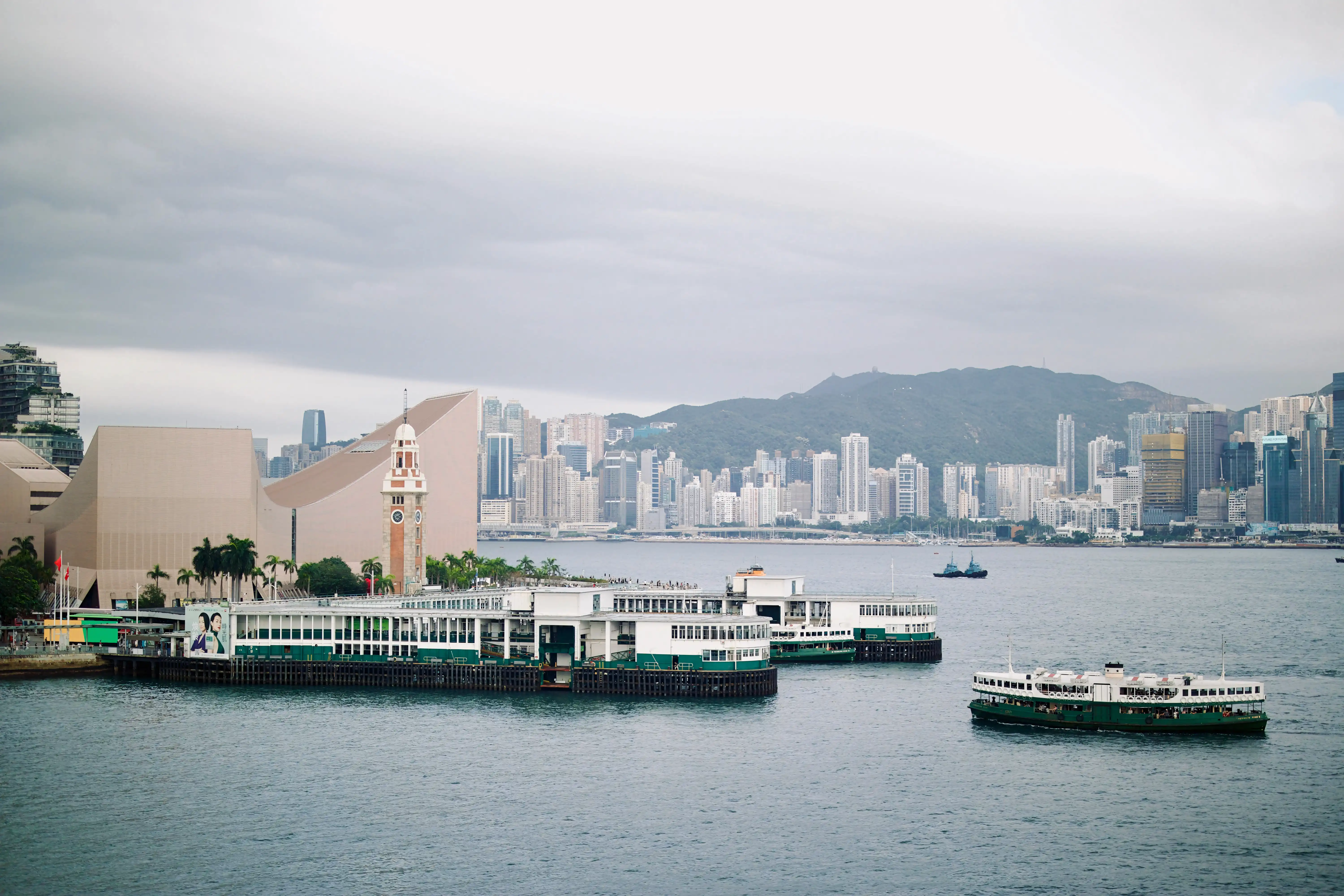 Hong Kong skyline at twilight with city lights reflecting on Victoria Harbour
